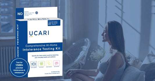 A woman relaxing on a couch on the right side of screen and in the left has UCARI Food Intolerance test kit resembling Food Sensitivity Vs Food Intolerance